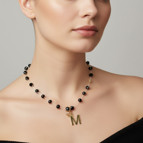 Necklace with Faceted Black Crystal Beads and “M” Initial Pendant