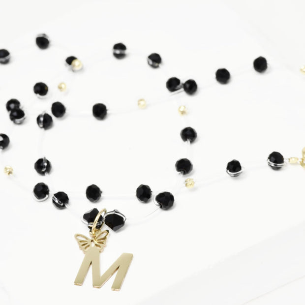 Necklace with Faceted Black Crystal Beads and “M” Initial Pendant