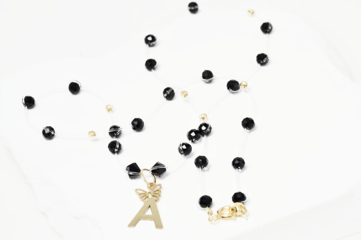 Necklace with Faceted Black Crystal Beads and “A” Initial Pendant