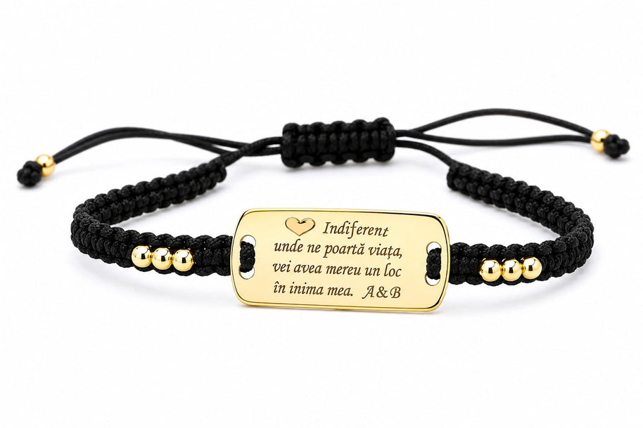 Personalised black cord bracelet with gold-tone engraved message plate