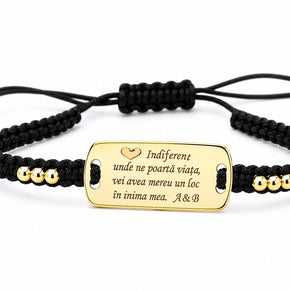 Personalised black cord bracelet with gold-tone engraved message plate