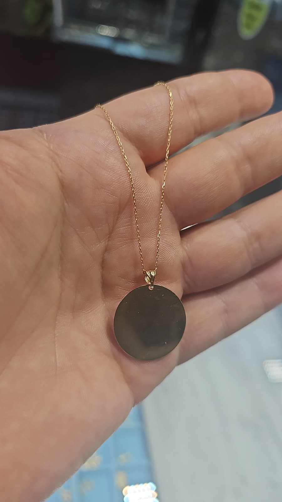 Round 14K gold pendant with fine chain, shown before Waterloo Clock engraving